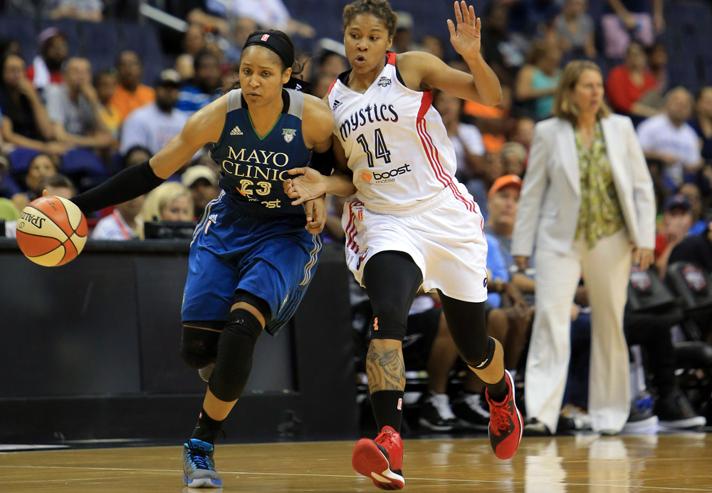 August 16 2015:  Washington Mystics guard Tierra Ruffin-Pratt (14) pushes into Minnesota Lynx forward Maya Moore (23) during a WNBA game at Verizon Center, in Washington D.C.
Mystics won 77-69.