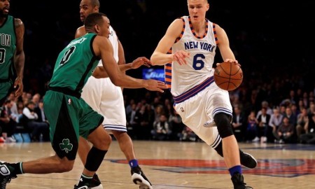 Jan 12, 2016; New York, NY, USA; New York Knicks forward Kristaps Porzingis (6) drives to the basket past Boston Celtics guard Avery Bradley (0) during the first half of an NBA basketball game at Madison Square Garden. Mandatory Credit: Adam Hunger-USA TODAY Sports