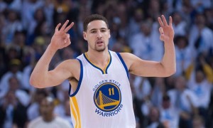 January 5, 2015; Oakland, CA, USA; Golden State Warriors guard Klay Thompson (11) celebrates after making a three-point basket during the first quarter against the Oklahoma City Thunder at Oracle Arena. The Warriors defeated the Thunder 117-91. Mandatory Credit: Kyle Terada-USA TODAY Sports