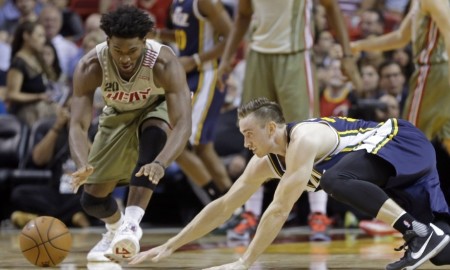 Utah Jazz forward Gordon Hayward, right, and Miami Heat forward Justise Winslow (20) go after the ball in the first half of an NBA basketball game, Thursday, Nov. 12, 2015, in Miami. (AP Photo/Alan Diaz)
