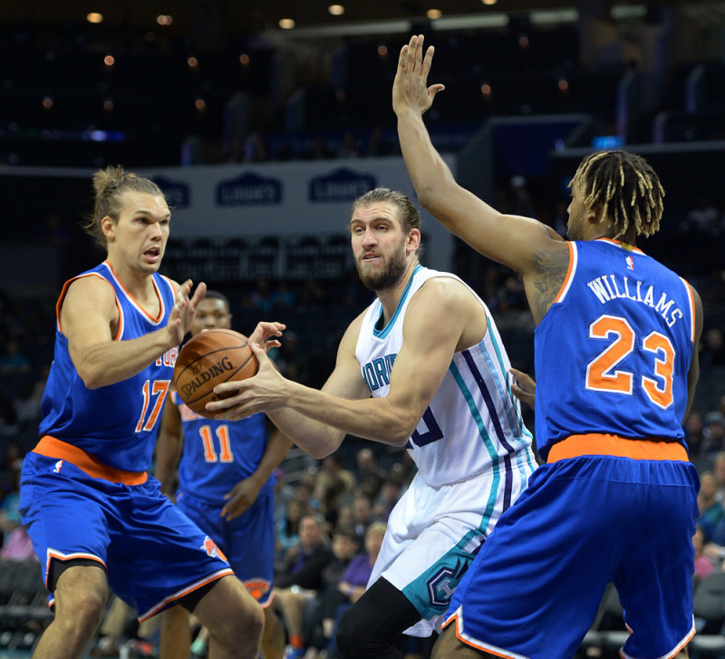 Oct. 17, 2015 - Charlotte, NC, USA - The Charlotte Hornets' Spencer Hawes, middle, fights to maintain control of the ball in the lane as the New York Knicks' Lou Amundson, left, and Derrick Williams, right, apply defensive pressure in preseason action on Saturday, Oct. 17, 2015, at Time Warner Cable Arena in Charlotte, N.C.  (Photo by Charlotte Observer/Zuma Press/Icon Sportswire)