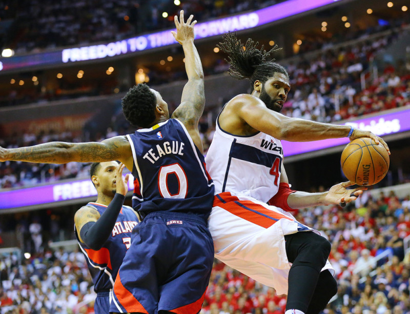 May 9, 2015 - Washington, DC, USA - The Washington Wizards' Nene, right, passes around the Atlanta Hawks' Jeff Teague (0) during Game 3 in the Eastern Conference semifinals at the Verizon Center in Washington, D.C., on Saturday, May 9, 2015.