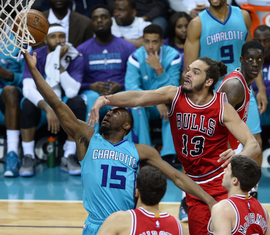March 13, 2015 - Charlotte, NC, USA - The Charlotte Hornets' Kemba Walker (15) drives to the basket for a shot attempt against the Chicago Bulls' Joakim Noah (13) on Friday, March 13, 2015, at Time Warner Cable Arena in Charlotte, N.C