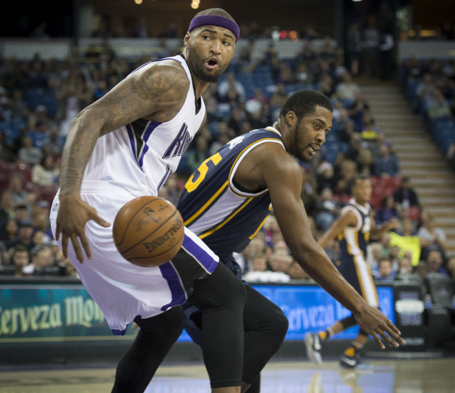 Dec. 8, 2015 - Sacramento, CA, USA - The Sacramento Kings' DeMarcus Cousins, left, looks for the ball after a steal against Utah Jazz forward Derrick Favors on Tuesday, Dec. 8, 2015 at Sleep Train Arena in Sacramento, Calif. The Kings won, 114-106 (Photo by Hector Amezcua/Zuma Press/Icon Sportswire)