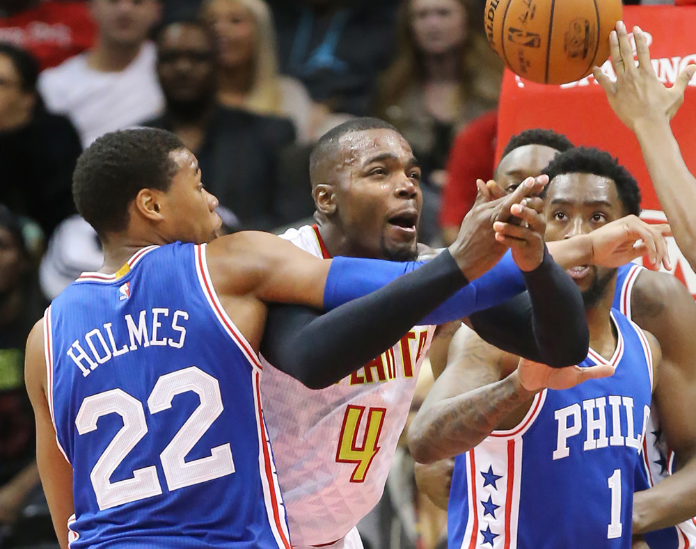 Dec. 16, 2015 - Atlanta, GA, USA - The Atlanta Hawks' Paul Millsap (4) loses the ball as he is fouled by the Philadelphia 76ers' Richaun Holmes (22) under the basket during the second half on Wednesday, Dec. 16, 2015, at Philips Arena in Atlanta. The Hawks won, 127-106 (Photo by Curtis Compton/Zuma Press/Icon Sportswire)