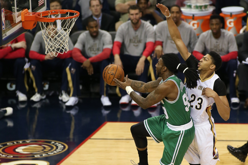 March 6, 2015 - Boston Celtics Forward Jae Crowder (99) [3405] drives to the goal with New Orleans Pelicans Forward Anthony Davis (23) [3407] behind during the game between the New Orleans Pelicans and the Boston Celtics at Smoothie King Center in New Orleans, LA. Boston Celtics defeated the New Orleans Pelicans 104-98