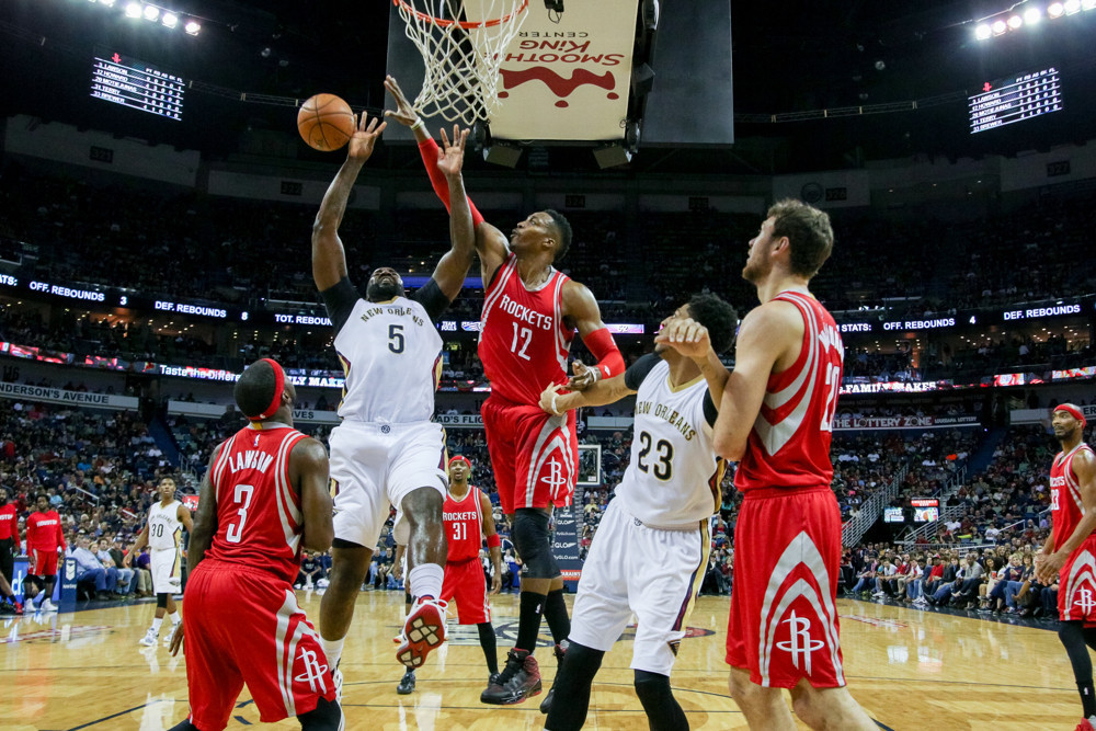 December 26, 2015:  Houston Rockets center Dwight Howard (12) blocks the shot of New Orleans Pelicans center Kendrick Perkins (5) during the game between the New Orleans Pelicans and the Houston Rockets at the Smoothie King Center in New Orleans, LA.    (Photograph by Stephen Lew/Icon Sportswire)
