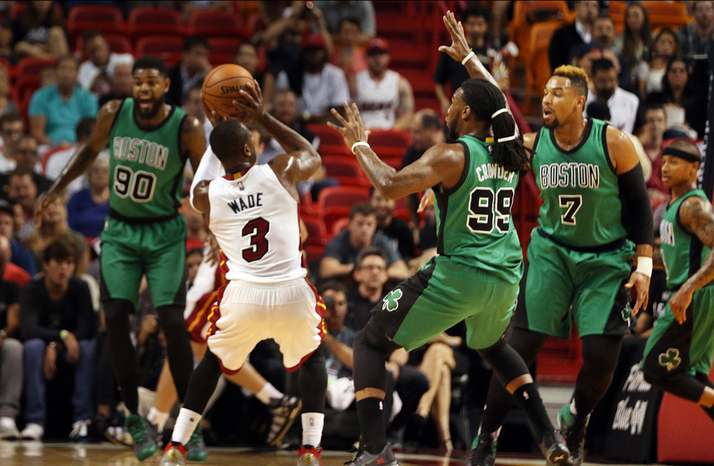 Nov. 30, 2015 - Miami, FL, USA - Miami Heat guard Dwyane Wade attempts to shoot against Boston Celtics' Jae Crowder (99) and Jared Sullinger (7) during the first quarter on Monday, Nov. 30, 2015, at AmericanAirlines Arena in Miami (Photo by Pedro Portal/Zuma Press/Icon Sportswire)