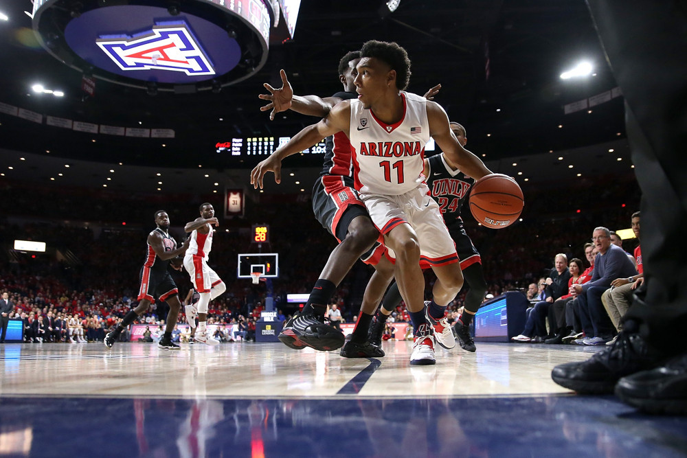 19 December 2015: Arizona Wildcats guard Allonzo Trier #11 is defended by UNLV Rebels forward Dwayne Morgan #15 during the second half of the college basketball game at McKale Center in Tucson, Arizona. The Arizona Wildcats beat the UNLV Rebels 82-70. (Photo by Chris Coduto/Icon Sportswire)
