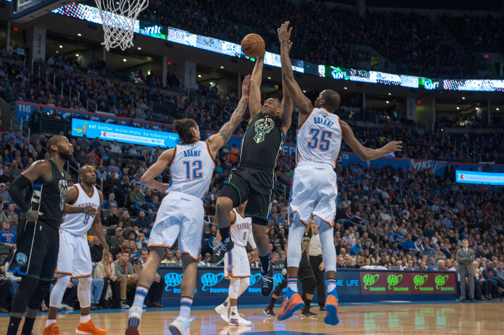 December 29, 2015: Milwaukee Bucks Forward Jabari Parker (12) [3717] going to for a dunk while Oklahoma City Thunder Forward Kevin Durant (35) [1864] and Oklahoma City Thunder Center Steven Adams (12) [3545] tries to stop him at Chesapeake Energy Arena in Oklahoma City (Photo by Torrey Purvey/Icon Sportswire)