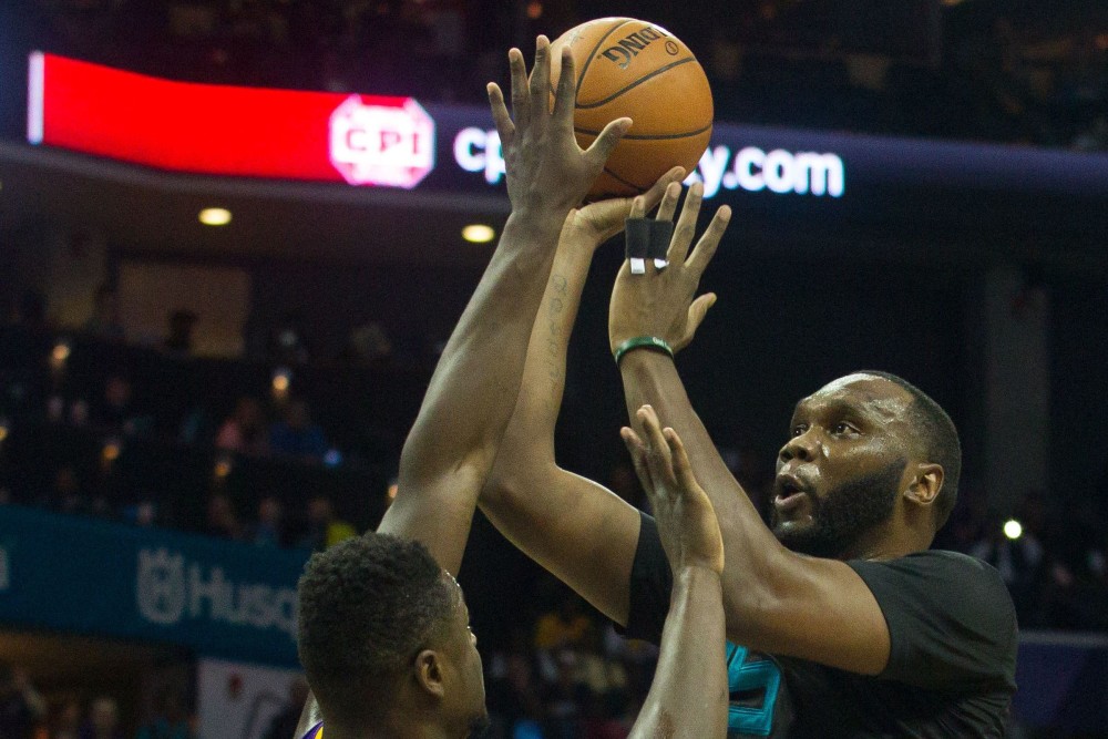 Dec 28, 2015; Charlotte, NC, USA; Charlotte Hornets center Al Jefferson (25) shoots the ball over Los Angeles Lakers forward Julius Randle (30) during the second half at Time Warner Cable Arena. The Hornets won 108-98. Mandatory Credit: Jeremy Brevard-USA TODAY Sports