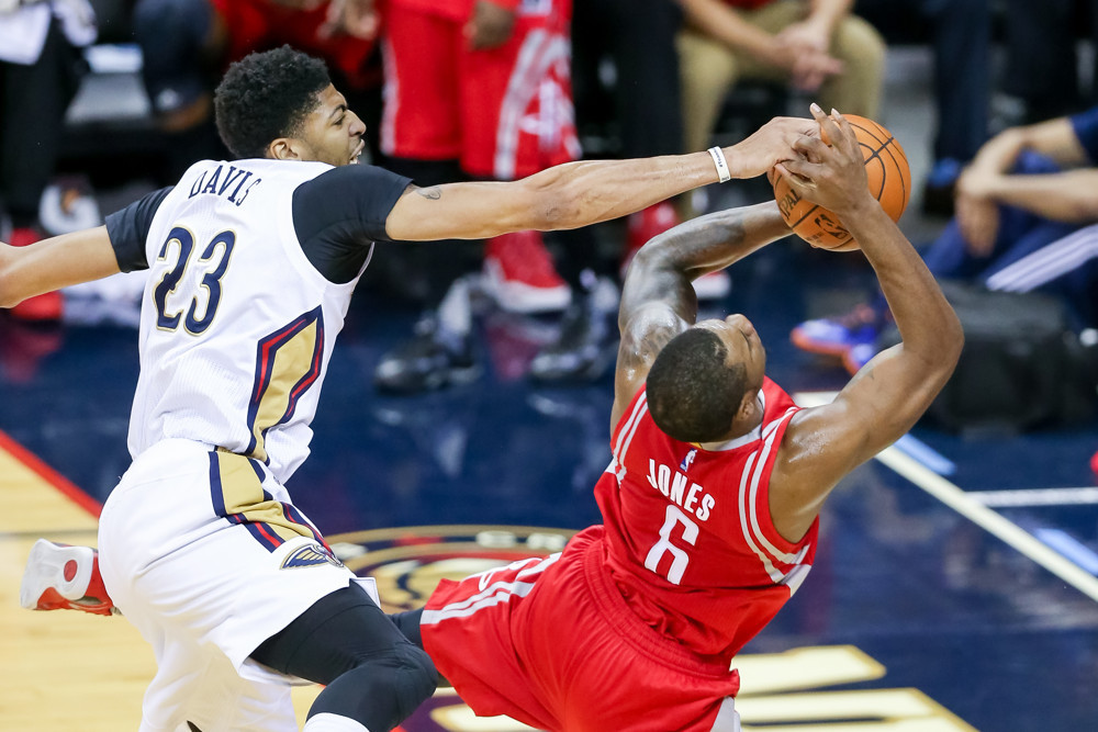 December 26, 2015:  New Orleans Pelicans forward Anthony Davis (23) fouls Houston Rockets forward Terrence Jones (6) as  he approaches the net during the game between the New Orleans Pelicans and the Houston Rockets at the Smoothie King Center in New Orleans, LA.    (Photograph by Stephen Lew/Icon Sportswire)