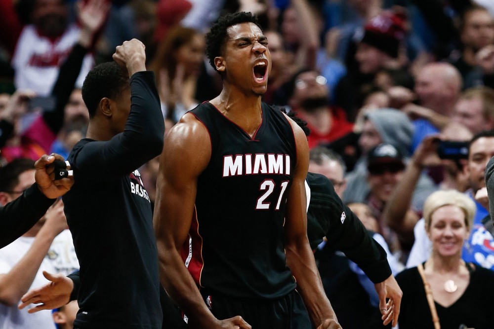 Jan 15, 2016; Denver, CO, USA; Miami Heat center Hassan Whiteside (21) celebrates after the buzzer sounds in the fourth quarter against the Denver Nuggets at the Pepsi Center. The Heat defeated the Nuggets 98-95. Mandatory Credit: Isaiah J. Downing-USA TODAY Sports