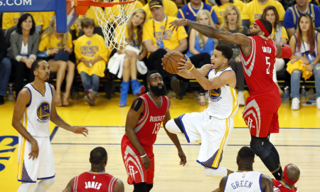 May 19, 2015 - Oakland, CA, USA - The Golden State Warriors' Stephen Curry drives to the hoop against the Houston Rockets' Josh Smith (5) as James Harden (13) looks on in the fourth quarter in Game 1 of the Western Conference finals at Oracle Arena in Oakland, Calif., on Tuesday, May 19, 2015. The Warriors won, 110-106