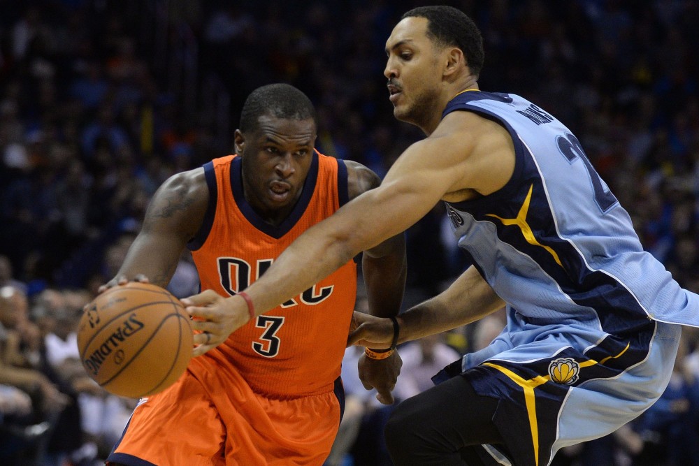 Jan 6, 2016; Oklahoma City, OK, USA; Oklahoma City Thunder guard Dion Waiters (3) dribbles the ball as Memphis Grizzlies center Ryan Hollins (20) defends during the second quarter at Chesapeake Energy Arena. Mandatory Credit: Mark D. Smith-USA TODAY Sports