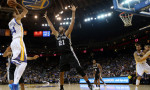 Nov. 11, 2014 - Oakland, CA, USA - The Golden State Warriors' Shaun Livingston (34) shoots over the San Antonio Spurs' Tim Duncan (21) in the first half at Oracle Arena in Oakland, Calif., on Tuesday, Nov. 11, 2014