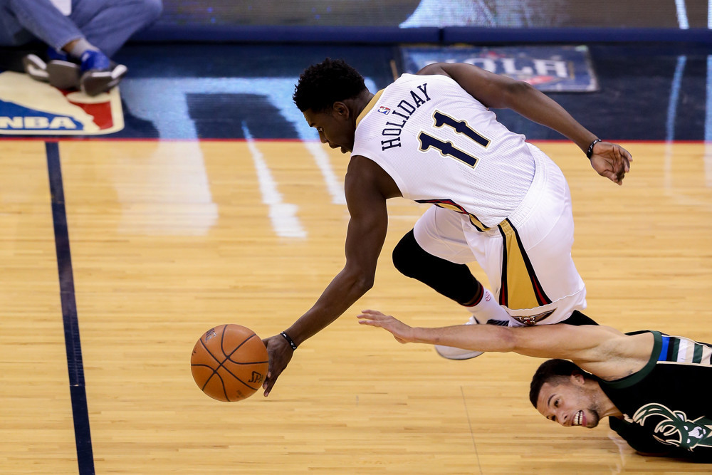 January 23, 2016: New Orleans Pelicans guard Jrue Holiday (11) steals the ball during the NBA game between the Milwaukee Bucks and the New Orleans Pelicans at the Smoothie King Center in New Orleans, LA. (Photograph by Stephen Lew/Icon Sportswire)