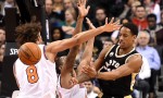 Jan 28, 2016; Toronto, Ontario, CAN; Toronto Raptors guard DeMar DeRozan (10) passes the ball past the arms of New York Knicks center Robin Lopez (8) and forward Lance Thomas (42) in the first quarter at Air Canada Centre. Mandatory Credit: Dan Hamilton-USA TODAY Sports