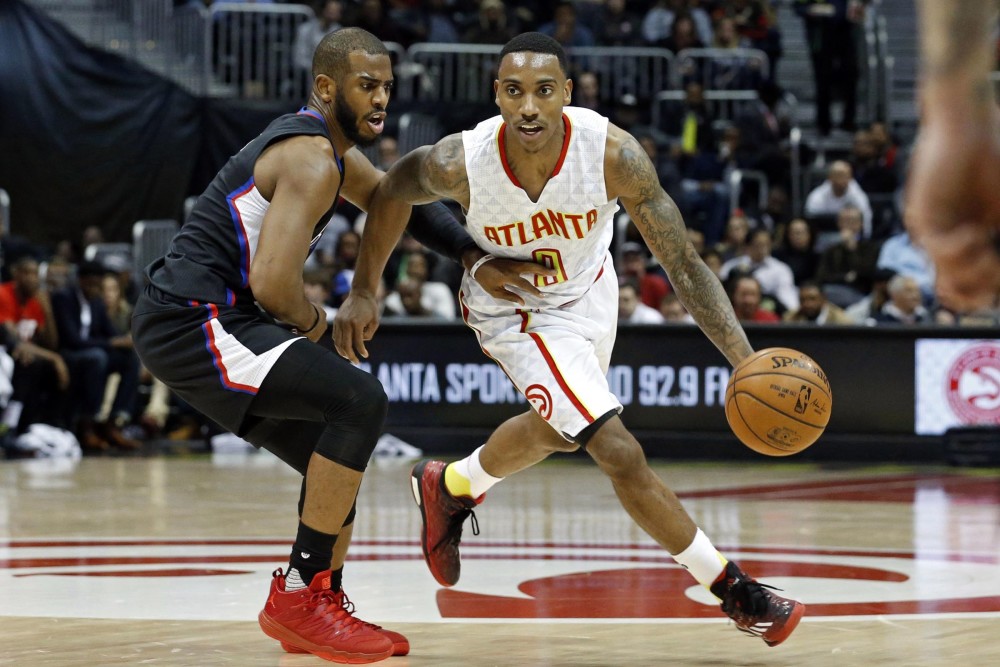 Jan 27, 2016; Atlanta, GA, USA; Atlanta Hawks guard Jeff Teague (0) drives against Los Angeles Clippers guard Chris Paul (3) in the third quarter of their game at Philips Arena. The Clippers won 85-83. Mandatory Credit: Jason Getz-USA TODAY Sports