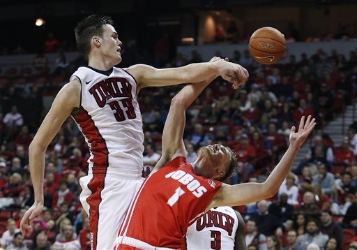 UNLV forward Stephen Zimmerman Jr. (33) blocks a shot by New Mexico guard Cullen Neal (1) during the first half of an NCAA college basketball game Tuesday, Jan. 12, 2016, in Las Vegas. (AP Photo/John Locher)