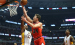 Dec. 25, 2014 - Chicago, IL, USA - Chicago Bulls forward Mike Dunleavy (34) goes up for a shot over Los Angeles Lakers center Jordan Hill (27) during the first period on Dec. 25, 2014 at the United Center in Chicago. The Bulls beat the Lakers 113-93