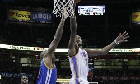 Oklahoma City Thunder forward Kevin Durant, right, shoots in front of Golden State Warriors center Marreese Speights, left, in the second quarter of an NBA basketball game in Oklahoma City, Friday, Jan. 16, 2015. (AP Photo/Sue Ogrocki)