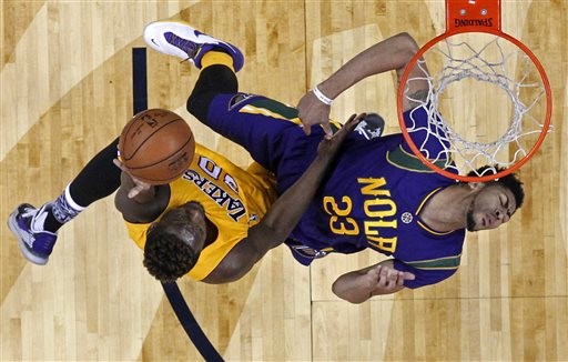 Los Angeles Lakers forward Julius Randle (30) drives to the basket against New Orleans Pelicans forward Anthony Davis (23) during the second half of an NBA basketball game in New Orleans, Thursday, Feb. 4, 2016. The Lakers won 99-96. (AP Photo/Gerald Herbert)