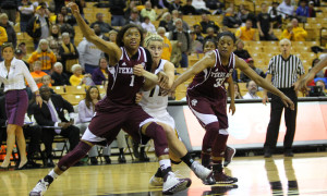 January 23, 2014: Texas A&M Aggies forward/guard Courtney Williams (1) and guard Courtney Walker (33) hold back Missouri Tigers guard Lindsey Cunningham (11) during a free throw attempt during the NCAA women's basketball game between the Missouri Tigers and the Texas A&M Aggies at Mizzou Arena in Columbia, Mo. Texas A&M won, 62-57.