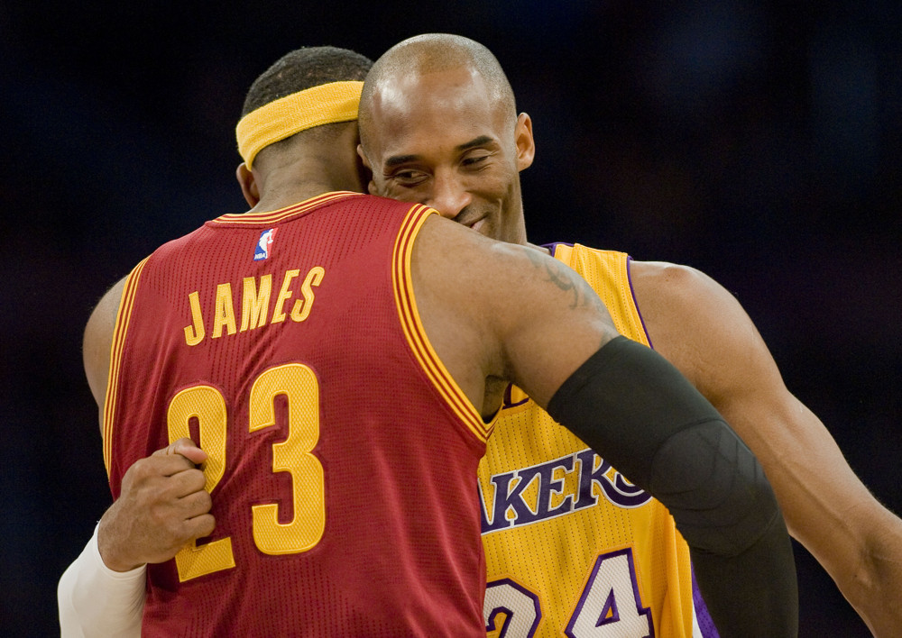 Jan. 15, 2015 - Los Angeles, CA, USA - Lakers guard Kobe Bryant, right, and Cleveland Cavaliers forward LeBron James give each other a hug before the start of Thursday's game