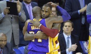 Feb 10, 2016; Cleveland, OH, USA; Cleveland Cavaliers forward LeBron James (23) hugs Los Angeles Lakers forward Kobe Bryant (24) near the end of the Cavaliers' 120-111 win at Quicken Loans Arena. Mandatory Credit: David Richard-USA TODAY Sports