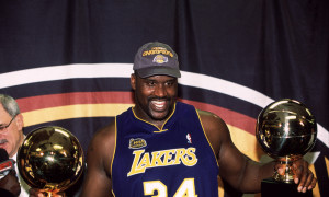 15 Jun 2001: Center Shaquille O'Neal #34 of the Los Angeles Lakers celebrates with the MVP and Championship trohpies after the a Lakers 108-96 victory over the Philadelphia 76ers in game five of the NBA Finals to win the title in Philadelphia, PA. Mandatory Credit: Manny Millan/SI/Icon SMI