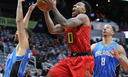 Jan. 18, 2016 - Atlanta, GA, USA - Atlanta Hawks guard Jeff Teague drives to the basket for two points past Orlando Magic defenders Evan Fournier, left, and Channing Frye on Monday, Jan. 18, 2016, at Philips Arena in Atlanta (Photo by Curtis Compton/Zuma Press/Icon Sportswire)