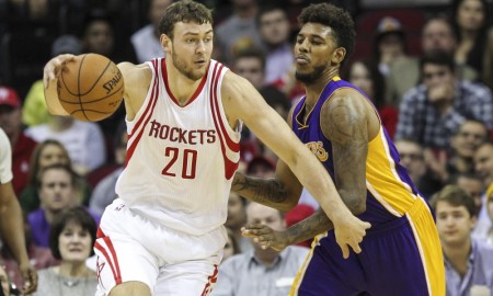 Dec 12, 2015; Houston, TX, USA; Houston Rockets forward Donatas Motiejunas (20) drives the ball as Los Angeles Lakers forward Nick Young (0) defends during the fourth quarter at Toyota Center. Mandatory Credit: Troy Taormina-USA TODAY Sports