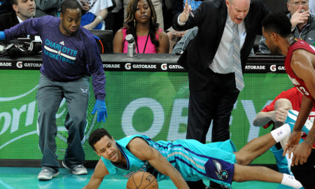 Jan. 21, 2015 - Charlotte, NC, USA - Charlotte Hornets guard Brian Roberts (22) falls to the floor as he tries to regain control of the ball while being fouled by the Miami Heat during second half action on Wednesday, Jan. 21, 2015 at Time Warner Cable Arena in Charlotte, N.C. The Hornets defeated the Heat 78-76