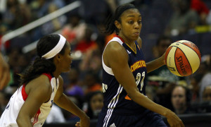 September13 2013: Ivory Latta (12) of the Washington Mystics follows Allison Hightower (23) of the Connecticut Sun during a WNBA game at Verizon Centre, in Washington DC. Mystics won 82-56.