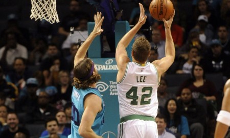 Dec 12, 2015; Charlotte, NC, USA; Boston Celtics forward center David Lee (42) drives to the basket and scores as he is defended by Charlotte Hornets forward center Spencer Hawes (00) during the first half of the game at Time Warner Cable Arena. Mandatory Credit: Sam Sharpe-USA TODAY Sports