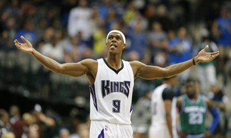 Sacramento Kings' Rajon Rondo (9) acknowledges fans mocking him in the closing seconds of the second half of an NBA basketball game against the Dallas Mavericks on Thursday, March 3, 2016, in Dallas. (AP Photo/Tony Gutierrez)