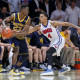 08 December 2015 - Michigan Wolverines guard Caris LeVert (#23) is defended by SMU Mustangs guard Keith Frazier (#4) during the college basketball game between the SMU Mustangs and the Michigan Wolverines at Moody Coliseum in Dallas, Texas. SMU won the game 82-58. (Photo by Matthew Visinsky/Icon Sportswire)