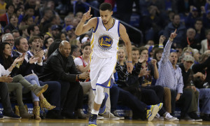 Golden State Warriors' Stephen Curry celebrates a score against the Portland Trail Blazers during the first half of an NBA basketball game Friday, March 11, 2016, in Oakland, Calif. (AP Photo/Ben Margot)