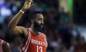 Houston Rockets guard James Harden (13) gestures in the fourth quarter of an NBA basketball game against the Boston Celtics, Friday, March 11, 2016, in Boston. Harden scored 32 points to lead the Rockets to a 102-98 victory over the Celtics. (AP Photo/Elise Amendola)