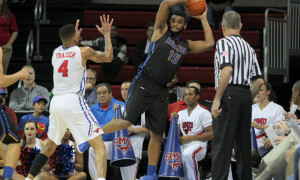 8 December 2014 - UCSB Gauchos forward Alan Williams (#15) saves the ball in the corner during the college basketball game between the SMU Mustangs and the University of California Santa Barbara Gauchos at Moody Coliseum in Dallas, Texas. SMU leads 38-29 at the half.