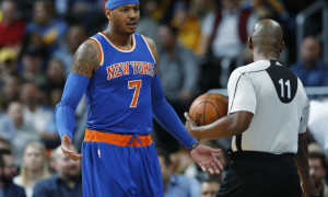 New York Knicks forward Carmelo Anthony, left, argues with referee Derrick Collins after being called for a foul against the Denver Nuggets in the first half of an NBA basketball game, Tuesday, March 8, 2016, in Denver. (AP Photo/David Zalubowski)