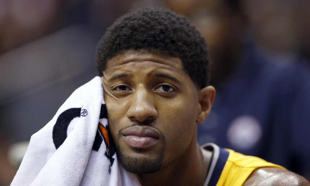 Indiana Pacers forward Paul George (13) sits on the bench during the first half of an NBA basketball game against the Washington Wizards, Saturday, March 5, 2016, in Washington. (AP Photo/Alex Brandon)