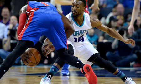 March 11, 2016 - Charlotte, NC, USA - The Charlotte Hornets' Kemba Walker, right, attempts to steal the ball from the Detroit Pistons' Reggie Jackson, left, during the first half on Friday, March 11, 2016, at Time Warner Cable Arena in Charlotte, N.C (Photo by Jeff Siner/Zuma Press/Icon Sportswire)