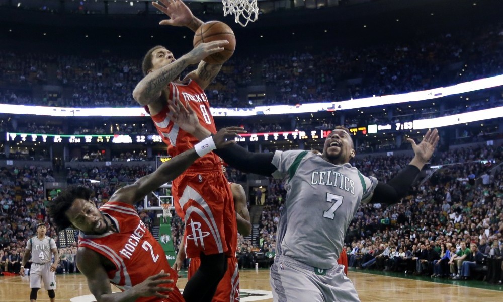 Houston Rockets forwards Michael Beasley (8) and Sam Dekker (7) fight for a rebound against Boston Celtics center Jared Sullinger (7) in the first half of an NBA basketball game, Friday, March 11, 2016, in Boston. (AP Photo/Elise Amendola)
