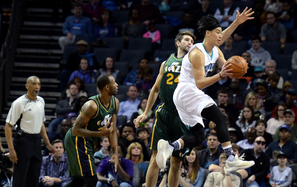 Jan. 18, 2016 - Charlotte, NC, USA - Charlotte Hornets guard Jeremy Lin, right, flies across the lane looking to pass to a teammate as Utah Jazz center Jeff Withey, center, applies defensive pressure during first half action on Monday, Jan. 18, 2016, at Time Warner Cable Arena in Charlotte, N.C (Photo by Jeff Siner/Zuma Press/Icon Sportswire)