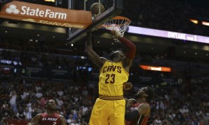 Cleveland Cavaliers forward LeBron James (23) shoots over Miami Heat forward Joe Johnson (2) and Amare Stoudemire, right, during the first half of an NBA basketball game, Saturday, March 19, 2016, in Miami. (AP Photo/Lynne Sladky)