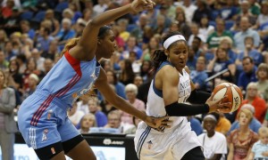 Minnesota Lynx forward Maya Moore, right, drives past Atlanta Dream forward Reshanda Gray, left, during the first half of a WNBA basketball game, Friday, July 31, 2015, in Minneapolis. (AP Photo/Stacy Bengs)