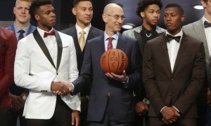 NBA Commissioner Adam Silver, center, poses for photos with prospective NBA draft picks Buddy Hield, left, Kris Dunn, right, Ben Simmons, third from left, and Brandon Ingram, second from right, before the NBA basketball draft, Thursday, June 23, 2016, in New York. (AP Photo/Frank Franklin II)