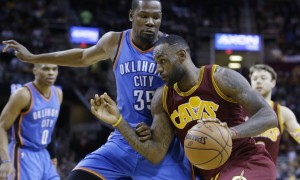 Cleveland Cavaliers' LeBron James, front, drives past Oklahoma City Thunder’s Kevin Durant in the second half of an NBA basketball game, Thursday, Dec. 17, 2015, in Cleveland. The Cavaliers won 104-100. (AP Photo/Tony Dejak)